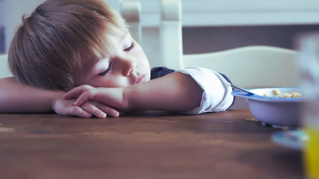 Children Fall sleep on table while eating