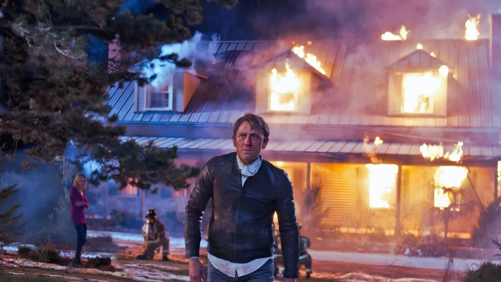 Man walking away from burned house